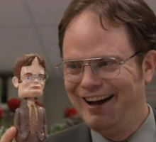 dwight looking happy about his bobblehead